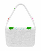 Colorful beaded handmade bag with fish and sea-themed designs on a white background