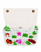 Colorful beaded handmade bag with fish and sea-themed designs on a white background