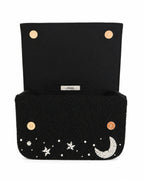 Black beaded handmade bag with star and moon designs on a white background