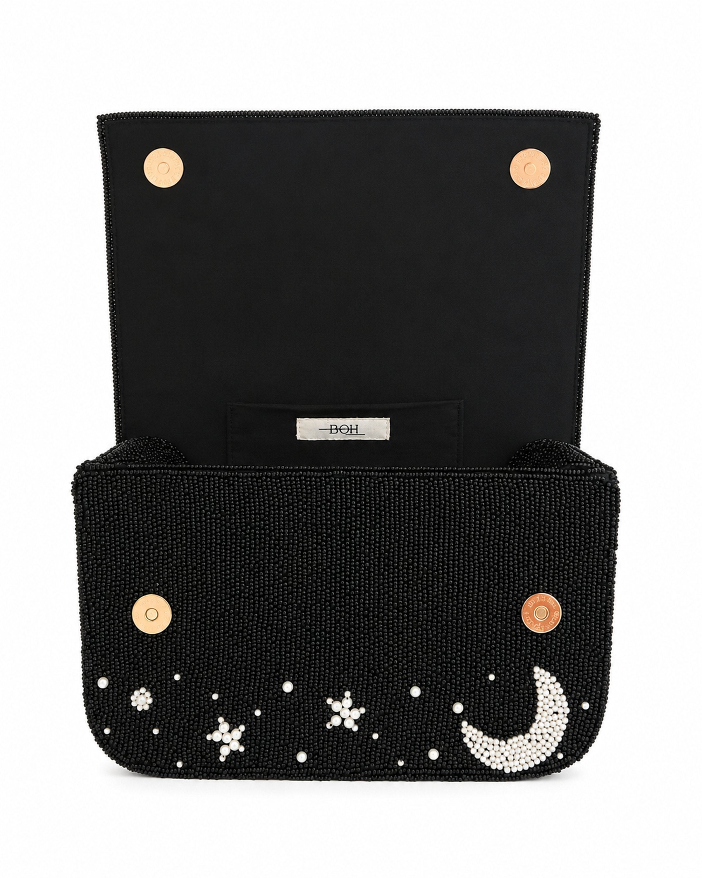 Black beaded handmade bag with star and moon designs on a white background