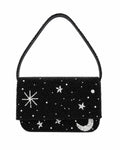 Black beaded handmade bag with star and moon designs on a white background
