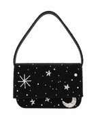 Black beaded handmade bag with star and moon designs on a white background