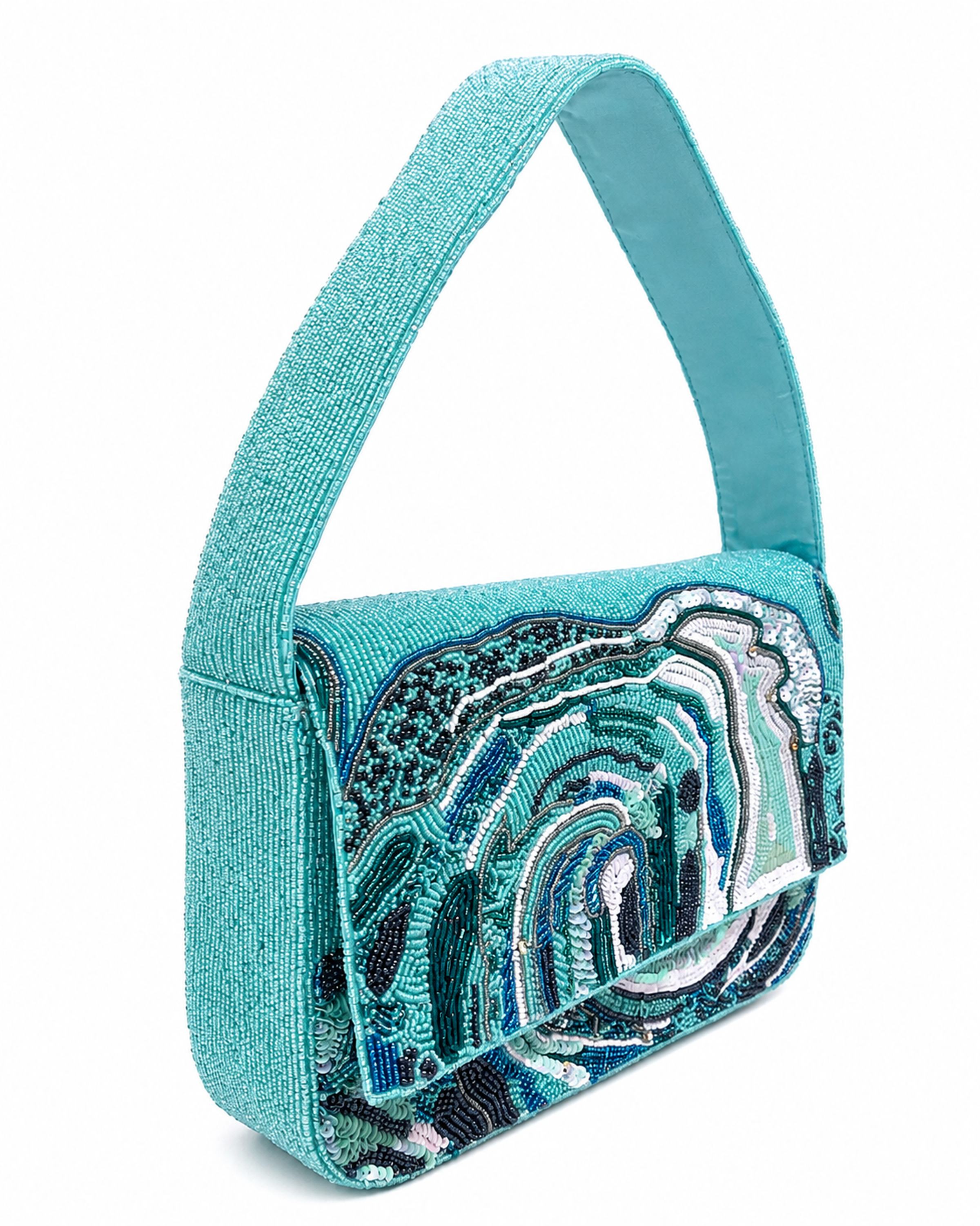 Turquoise handbag with ocean wave decorative pattern on a white background (beaded & handmade)