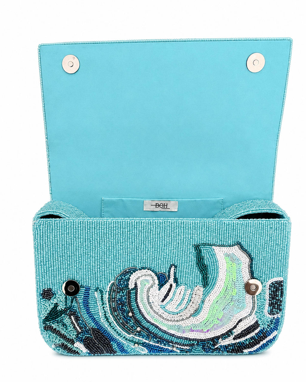 Turquoise handbag with ocean wave decorative pattern on a white background (beaded & handmade)