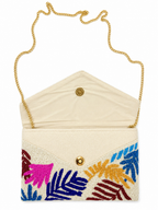 Tresboh Beaded clutch with colorful leaf patterns and a gold chain strap on a white background