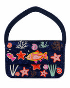 Navy blue handbag with colorful embroidered sea-themed designs on a white background (handmade beaded bag)
