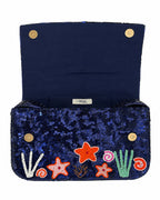 Navy blue handbag with colorful embroidered sea-themed designs on a white background (handmade beaded bag)